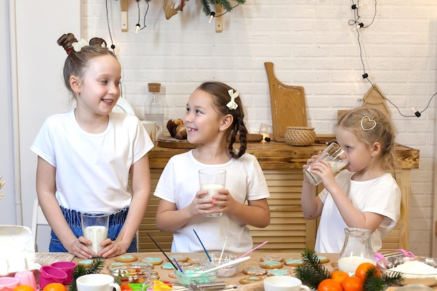 Beautiful little girls cook cookie dough bake cookies in the kitchen Cooking homemade food Ginger cookie recipe