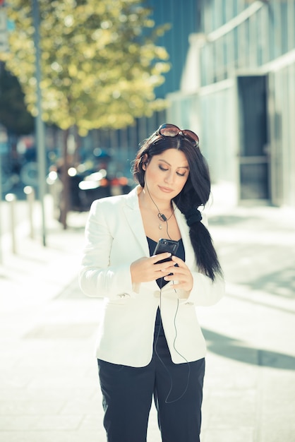 beautiful long black hair elegant business woman using smartphone