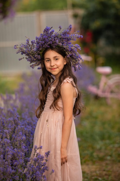 Beautiful long hair girl near lavender bushes