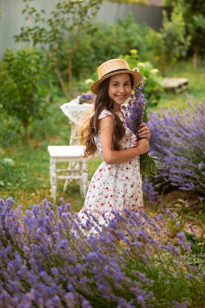 Beautiful long hair girl near lavender bushes