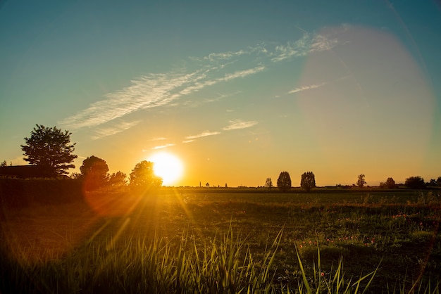 Beautiful and magnificent Sunset in the countryside in the fields