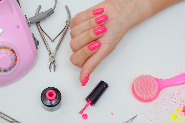 beautiful manicure closeup in the salon on a white background isolate beauty and health concept