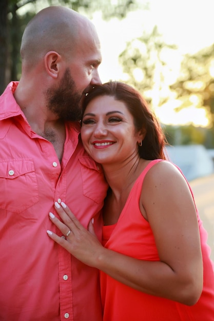 Beautiful mature couple on summer evening at sunset