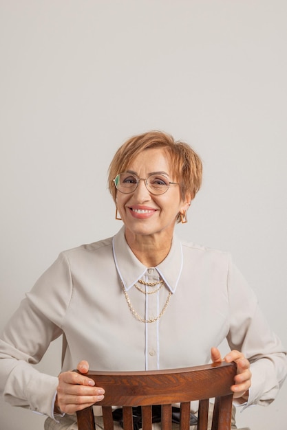 Beautiful middleaged baby boomer woman in glasses happy smiling