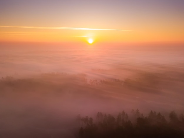 Beautiful misty dawn Flying above the clouds drone video