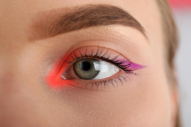 Beautiful model girl face with makeup, close up