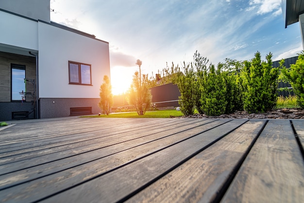 Beautiful modern house. Concrete out-to-date building. View from the garden.