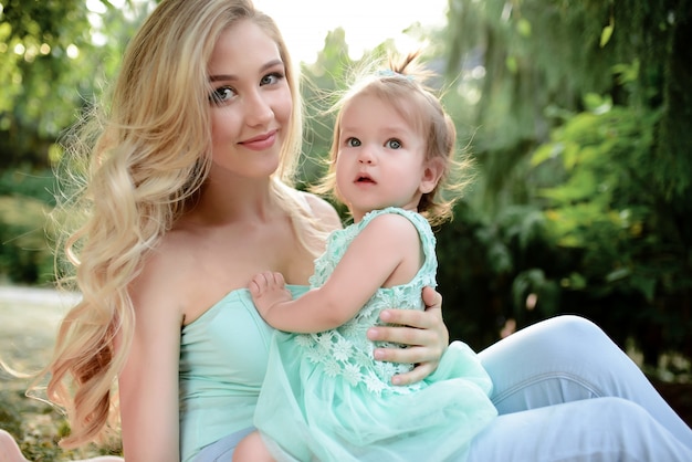 Beautiful mother and daughter outdoors