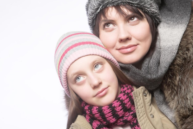 Beautiful mother daughter winter portrait