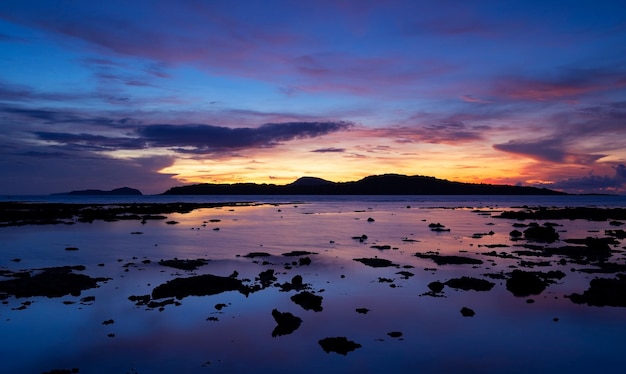 Beautiful motion blur long exposure sunset or sunrise with dramatic sky clouds over calm sea in tropical phuket island Amazing nature view and light of nature seascape