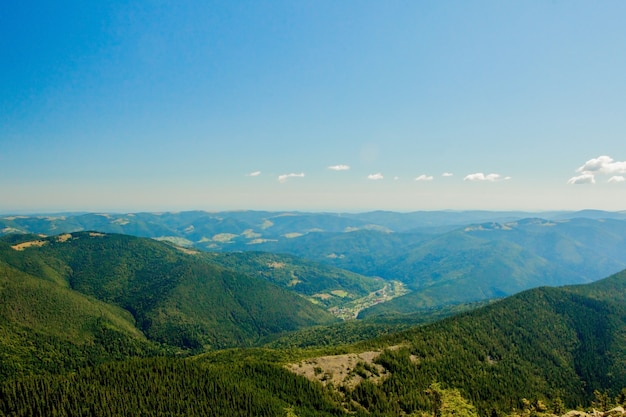 Beautiful mountain landscape, with mountain peaks covered with forest and a cloudy sky. Ukraine mountains, Europe