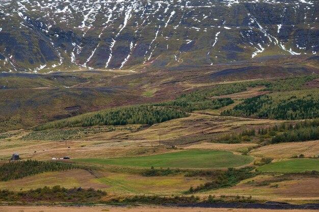 Beautiful mountain view during auto trip in Iceland Spectacular Icelandic landscape with scenic nature mountains fields clouds rocks