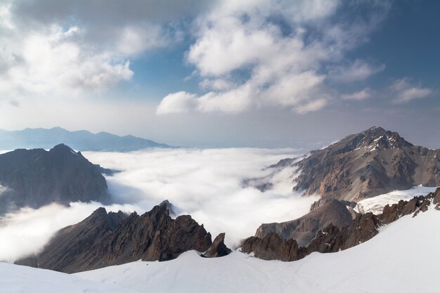 Beautiful mountain view from summit above the clouds