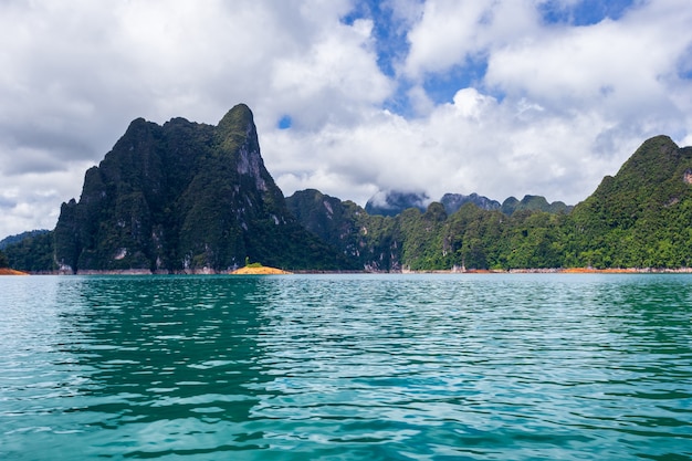 Beautiful mountains lake river sky and natural attractions in Ratchaprapha Dam at Khao Sok National Park, Surat Thani Province, Thailand.