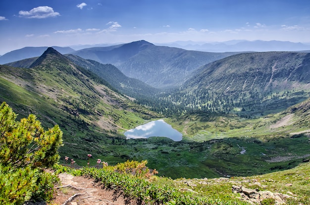 Beautiful mountains landscape over a calm lake of heart