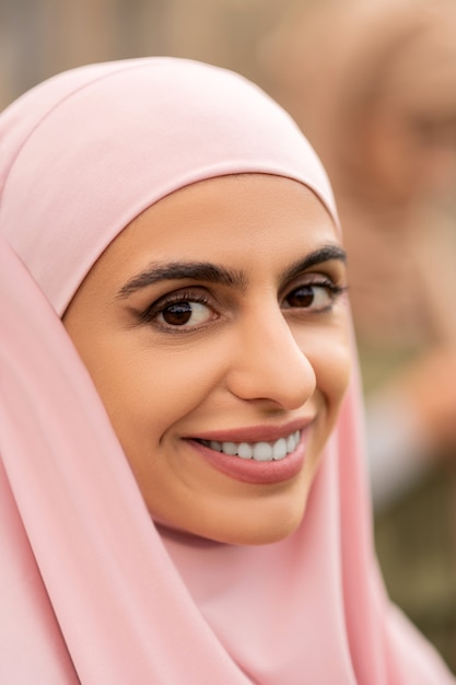 Beautiful muslim woman. Close up of young beautiful muslim woman wearing pink hjab