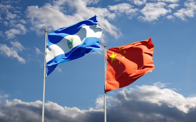 Beautiful national state flags of China and El Salvador together at the sky 