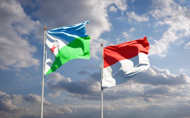 Beautiful national state flags of Djibouti and Indonesia together on blue sky