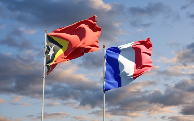 Beautiful national state flags of France and East Timor together at the sky 