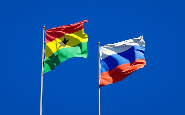 Beautiful national state flags of Ghana and Russia together on blue sky. 3D artwork