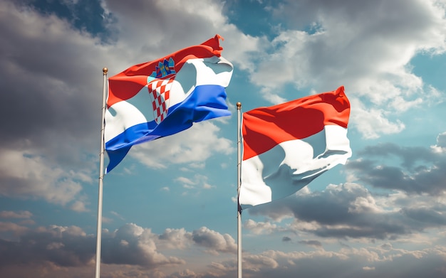 Beautiful national state flags of Indonesia and Croatia together on blue sky