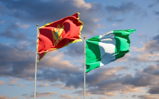 Beautiful national state flags of Montenegro and Nigeria together on blue sky