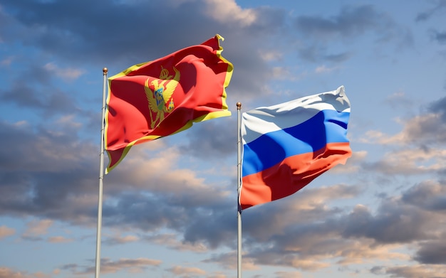 Beautiful national state flags of Montenegro and Russia together on blue sky. 3D artwork