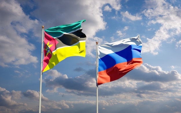 Beautiful national state flags of Mozambique and Russia together on blue sky. 3D artwork