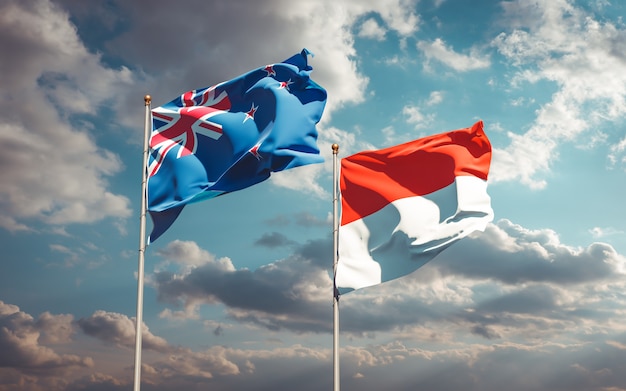 Beautiful national state flags of New Zealand and Indonesia together on blue sky