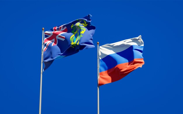 Beautiful national state flags of Pitcairn Islands and Russia together on blue sky. 3D artwork