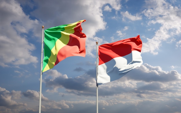 Beautiful national state flags of Republic of the Congo and Indonesia together on blue sky