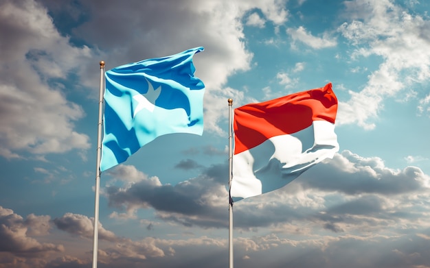 Beautiful national state flags of Somalia and Indonesia together on blue sky