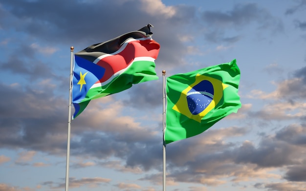 Beautiful national state flags of South Sudan and Brasil together on blue sky