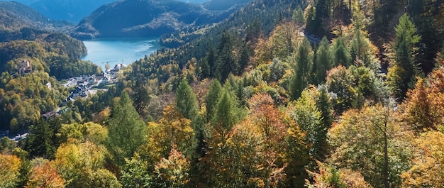 Beautiful nature of european alps landscape view of alpine mountains lake and village on a sunny day travel and destination scenery