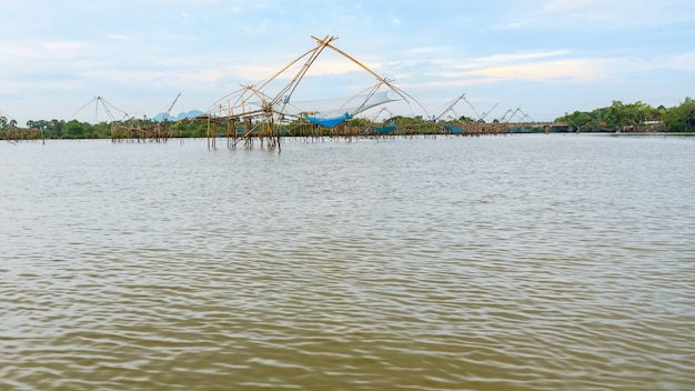 Beautiful nature landscape many Yok Yor is a fishing with local wisdom. Tool for catch fish of native people made of bamboo and net rural lifestyle at Pakpra canal, Baan Pak Pra, Phatthalung, Thailand