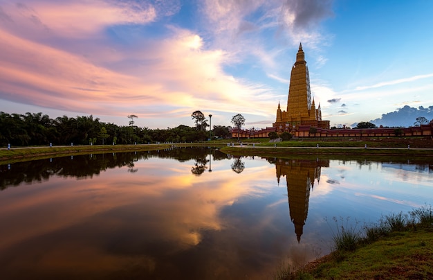 Beautiful nature with sunrise reflection on water at Wat Bang Thong, famous temple in Krabi, Thailand