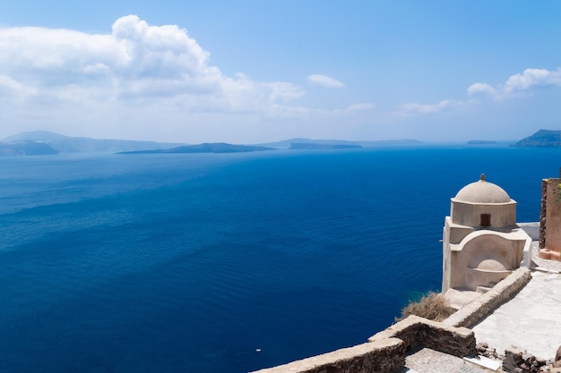 Beautiful Oia town on Santorini island, Greece. Traditional white architecture and greek orthodox ch