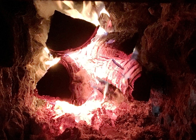 Beautiful old fireplace with light flame fire