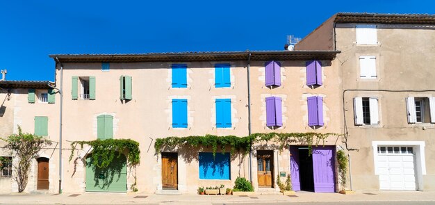 Beautiful old town street houses with colorful shutters in Provence France