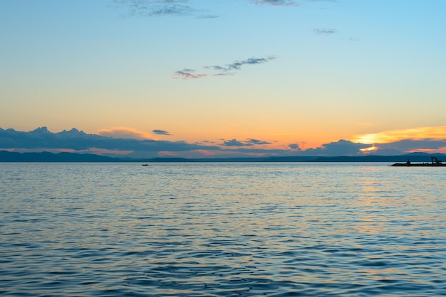 Beautiful orange sunset over the sea with soft selective focus Beauty of nature concept