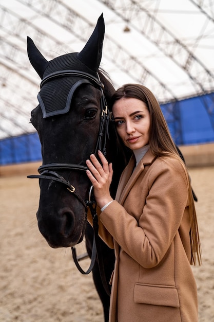 Beautiful outdoor holiday on the ranch Pretty woman portrait with horse