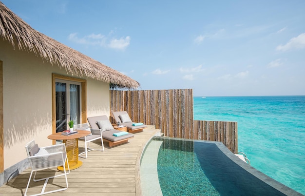 Beautiful Outdoor Pool Deck Sunrise Overwater Pool Villa somewhere in the Maldives