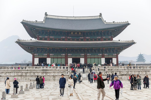 A beautiful pagoda and people walking at the entrance to a popular park in an Asian city History religion and architecture Seoul South Korea 20171230