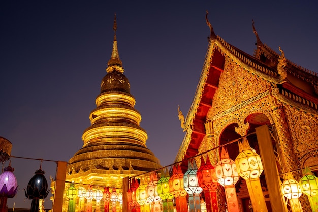 Beautiful pagoda with lantern against sunset sky at temple in Northern of Thailand.