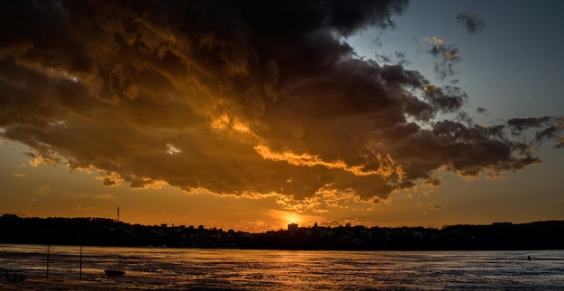 Beautiful panorama of the sunset over the lake in the crisis an incredibly beautiful cloud