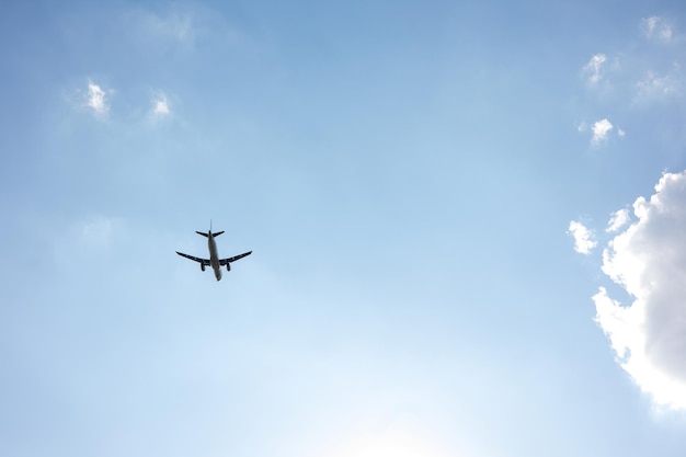 Beautiful Panoramic Background with flying plane in blue sky. Passenger airplane