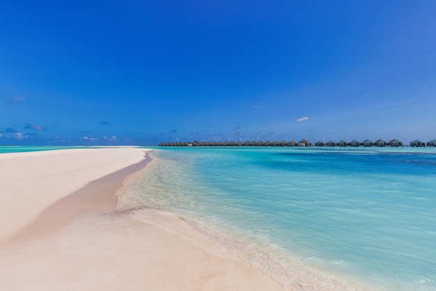 Beautiful panoramic landscape of over water villas, Maldives island, Indian Ocean. Luxury tropical