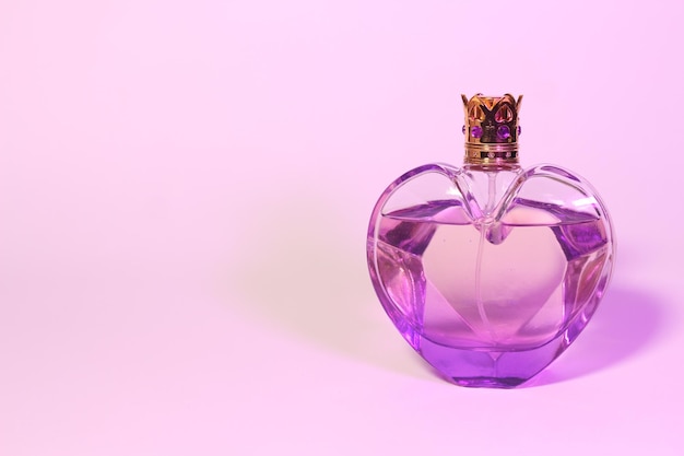 Beautiful Perfume Bottle on purple background