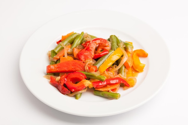 Beautiful photo closeup menu of fresh vegetable salad in a plate on a white background