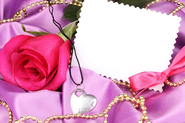 Beautiful pink rose with heart pendant